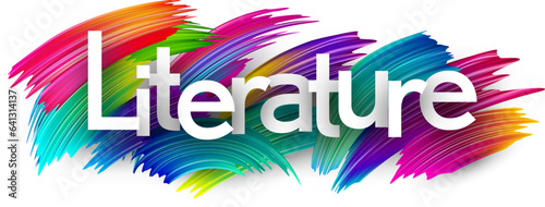 Literature paper word sign with colorful spectrum paint brush strokes over white.
