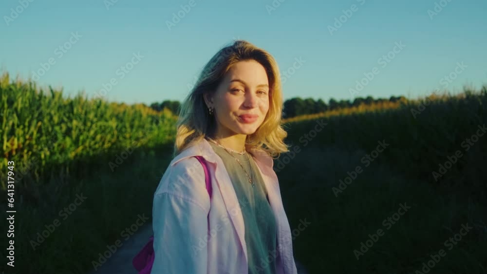 Portrait of young caucasian happy woman with bicycle near agricultural fields in countryside in summer day. Portrait of young caucasian happy woman with bicycle near agricultural fields in countryside in summer day.