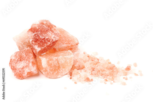 Chipped Himalayan salt stone, crystals and crushed blocks of natural pink salt isolated on white background photo