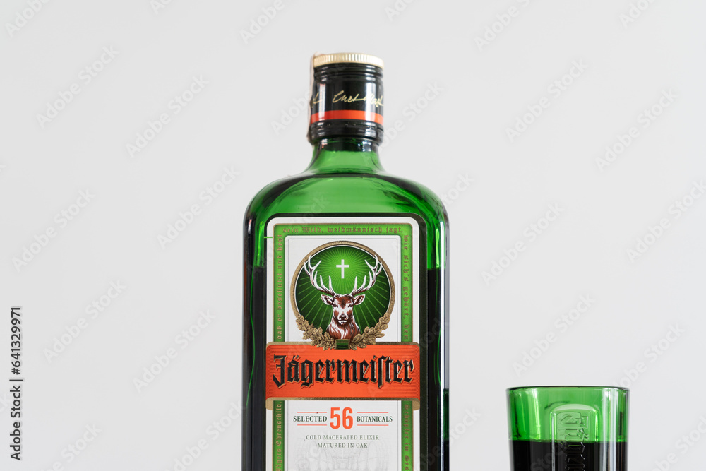 Jägermeister bottle and shot glass. German digestive alcohol drink