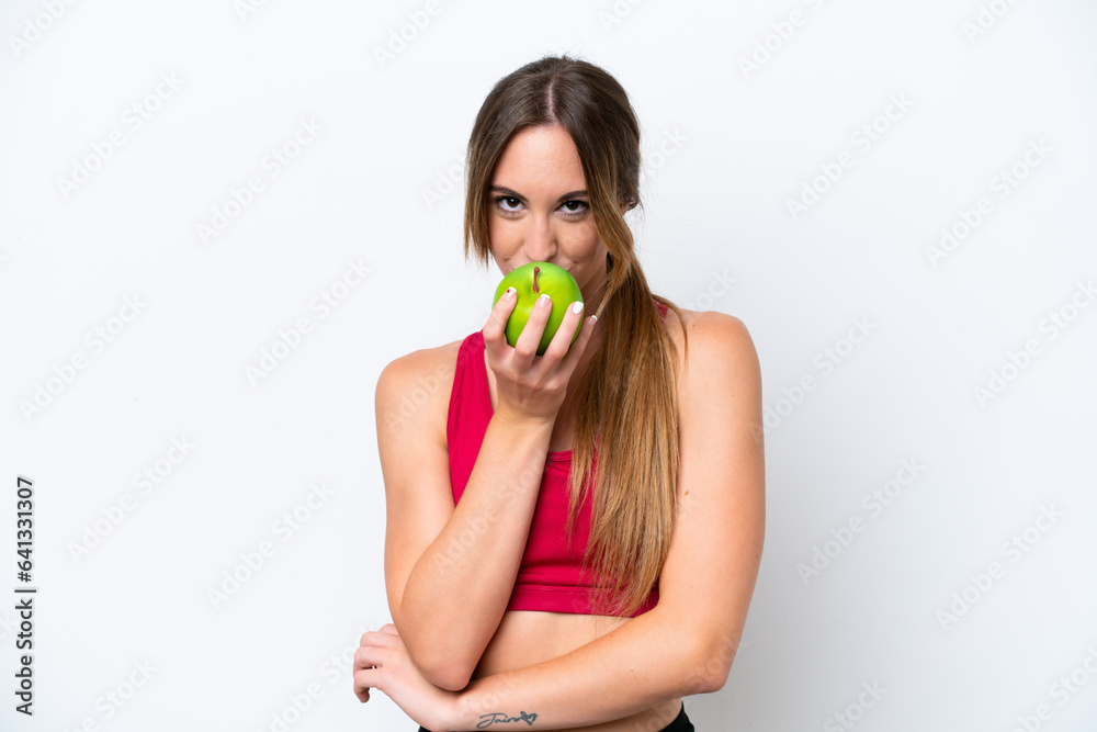 Young caucasian woman isolated on white background eating an apple Young caucasian woman isolated on white background eating an apple