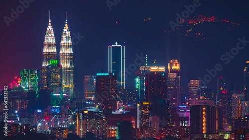 Time-lapse footage of Kuala Lumpur cityscape with Genting Highland visible at the background