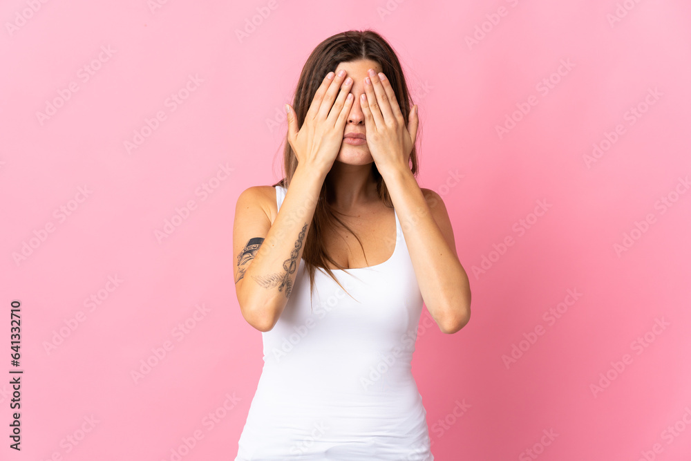 Young slovak woman isolated on pink background covering eyes by hands Young slovak woman isolated on pink background covering eyes by hands