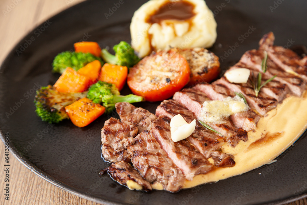 Striploin angus steak with mashed potato and grilled vegetable Striploin angus steak with mashed potato and grilled vegetable