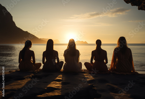 women are sitting on the beach in meditation pose, in the style of happenings, backlit photography, abrasive authenticity