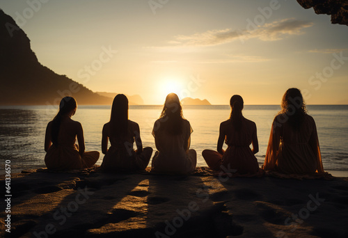 women are sitting on the beach in meditation pose  in the style of happenings  backlit photography  abrasive authenticity