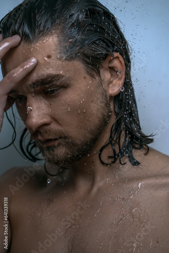 Beautiful male studio portrait with water
