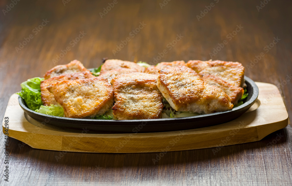 beautifully fried pieces of pork beautifully fried pieces of pork