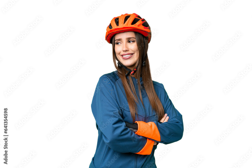 Young cyclist woman over isolated chroma key background with arms crossed and happy Young cyclist woman over isolated chroma key background with arms crossed and happy