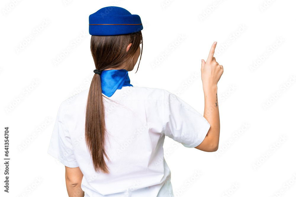 Airplane stewardess over isolated chroma key background pointing back with the index finger Airplane stewardess over isolated chroma key background pointing back with the index finger