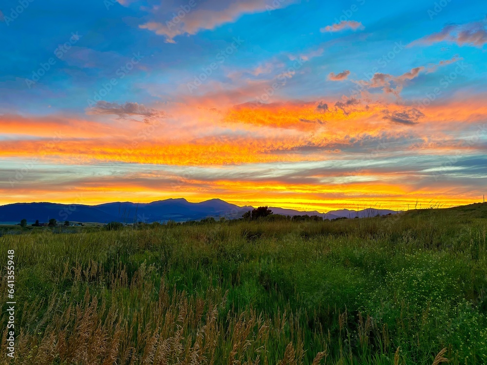 Colorful sunset over a field near Ennis, Montana