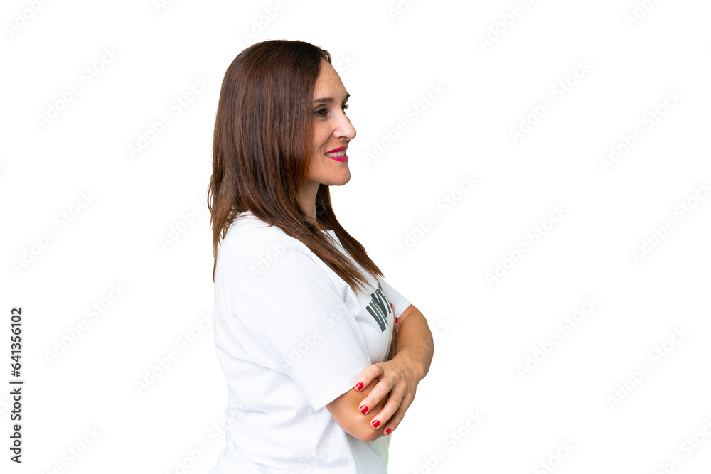 Middle age volunteer woman over isolated chroma key background in lateral position Middle age volunteer woman over isolated chroma key background in lateral position