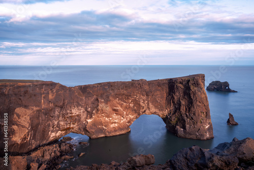 Arch rock in Iceland, kirk cliffs of moher at sunset