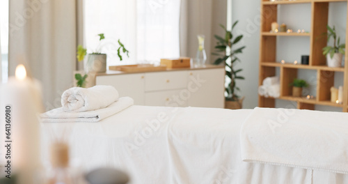 Wellness, relax and a massage table on an empty spa background for luxury wellness or treatment. Health, zen and hospitality with candles for peace or aromatherapy a room of a modern beauty salon