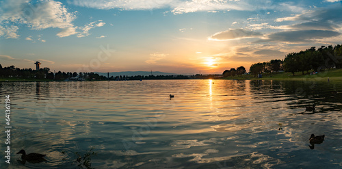 Lake schwarzl sunset panorama schwarzlsee near the styrian capitol graz in austria. View at surrounding mountains. Sunny day in Summer. Recreation photo