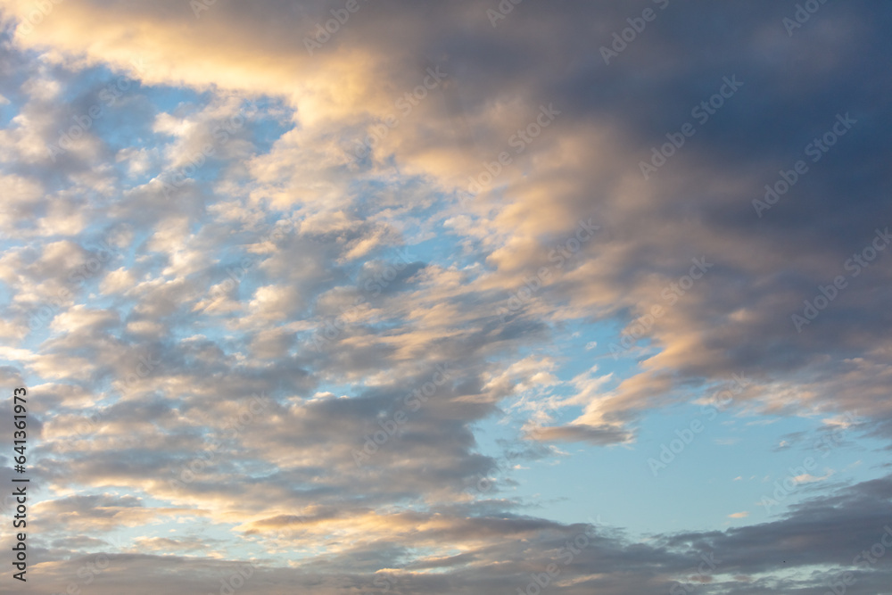 Colorful clouds at sunset as background