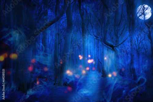 haunted forest in full moon night with spooky fog and lights, dark blue nature fantasy background for halloween, moonshine party or lantern festival © winyu