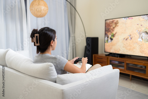 Woman play video game at home