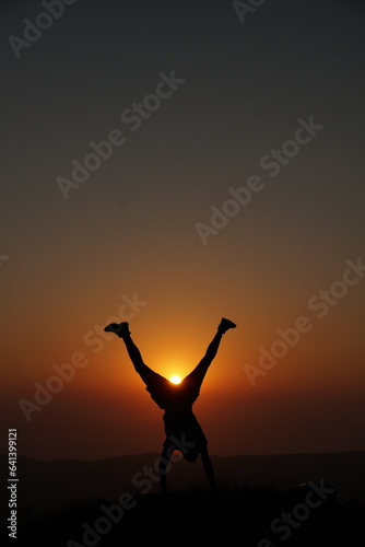 Silhouette of a person in the sunset