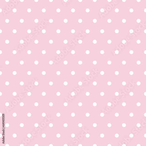 Polka dots on a pink background that looks simple and charming.