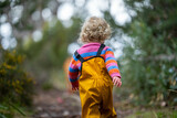 baby in the wild forest together walking in a park