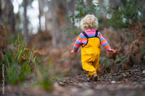 child exploring in the wild trees © Phoebe