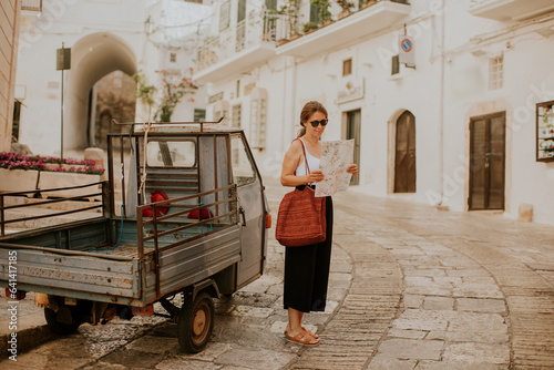 Female tourist with paper c...