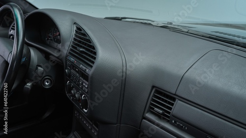 Black dashboard inside of a car photo