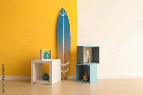 Surfboard with shelves near...