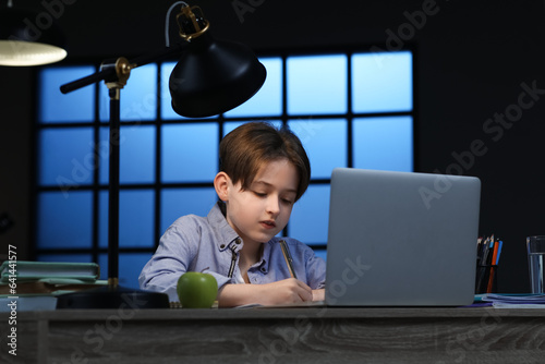 Little boy doing homework w...