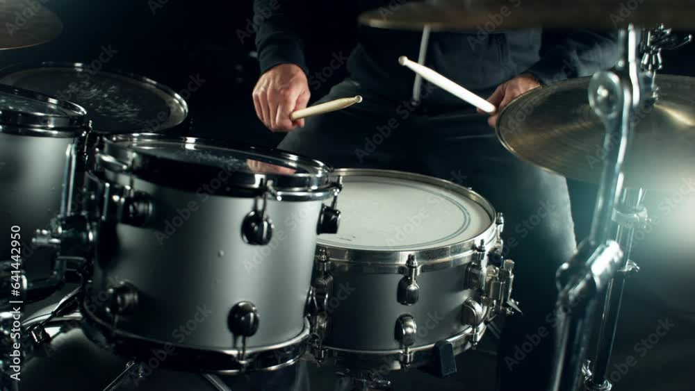 Drummer Banging on Drums With Lights Flashing. Drum Set, Drummer Plays on a Concert. Strobe Lights Flashing, Dark Atmosphere.