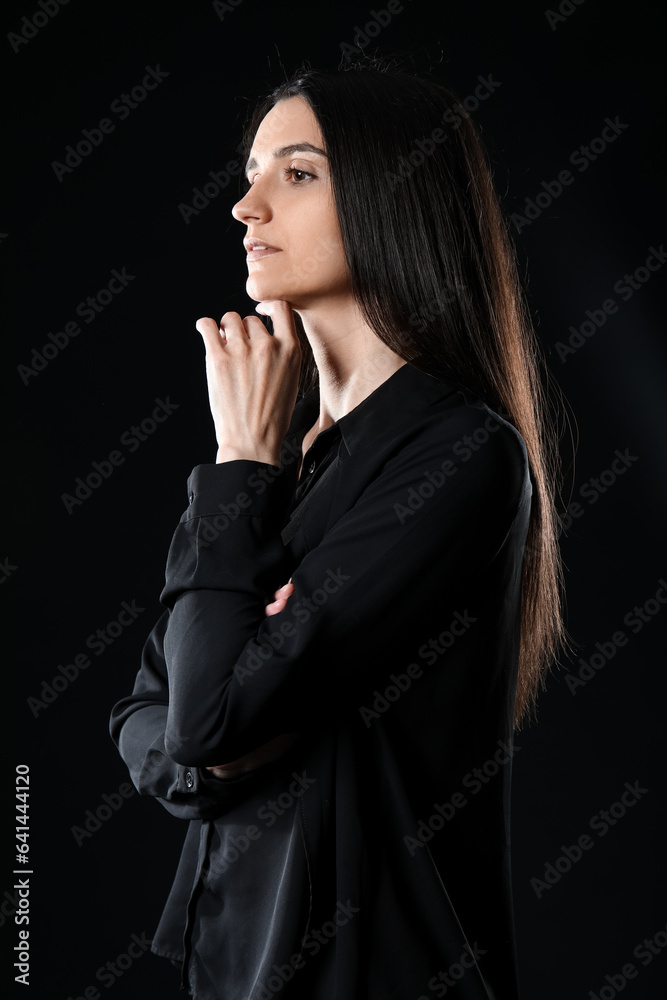 Beautiful young woman on black background Beautiful young woman on black background