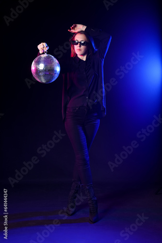 Young woman with disco ball...