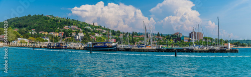 Valokuva A panorama view past boats moored on the harbour wall at Portoroz, Slovenia in s