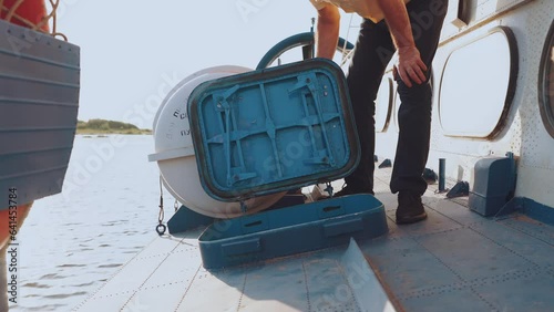 The hatch on the ship, the captain opens the hatch on the ship