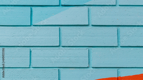 A blue interior exterior wall or a brightly colored wall can be used as a background or wallpaper.