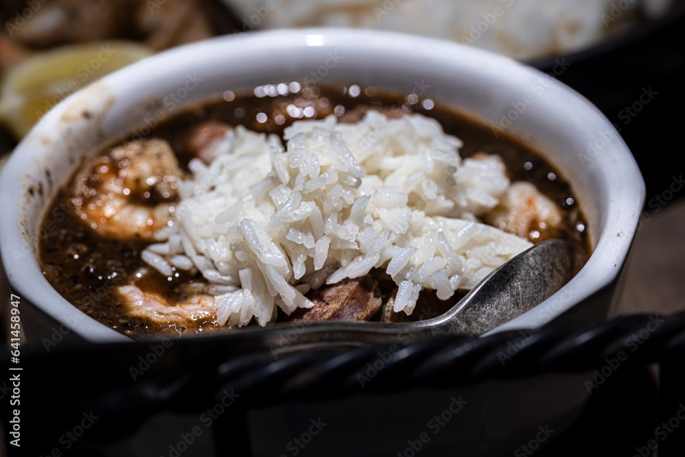 Seafood gumbo with rice and crab fingers. Seafood gumbo with rice and crab fingers.