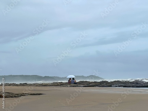 Couple sitting at the beach