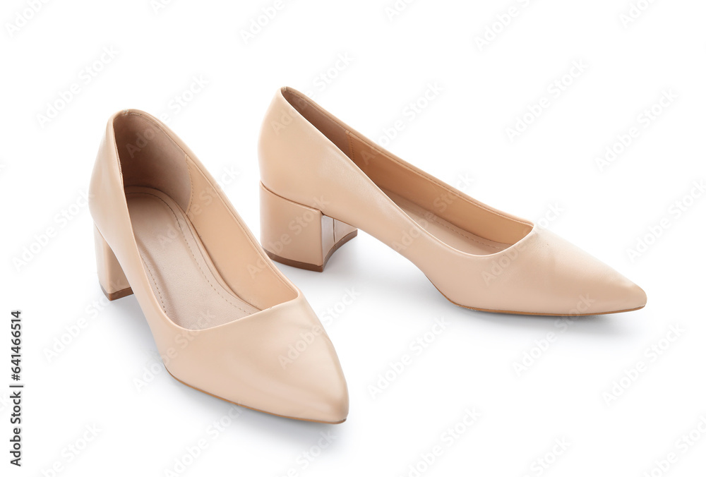 Stylish beige high heels on white background Stylish beige high heels on white background