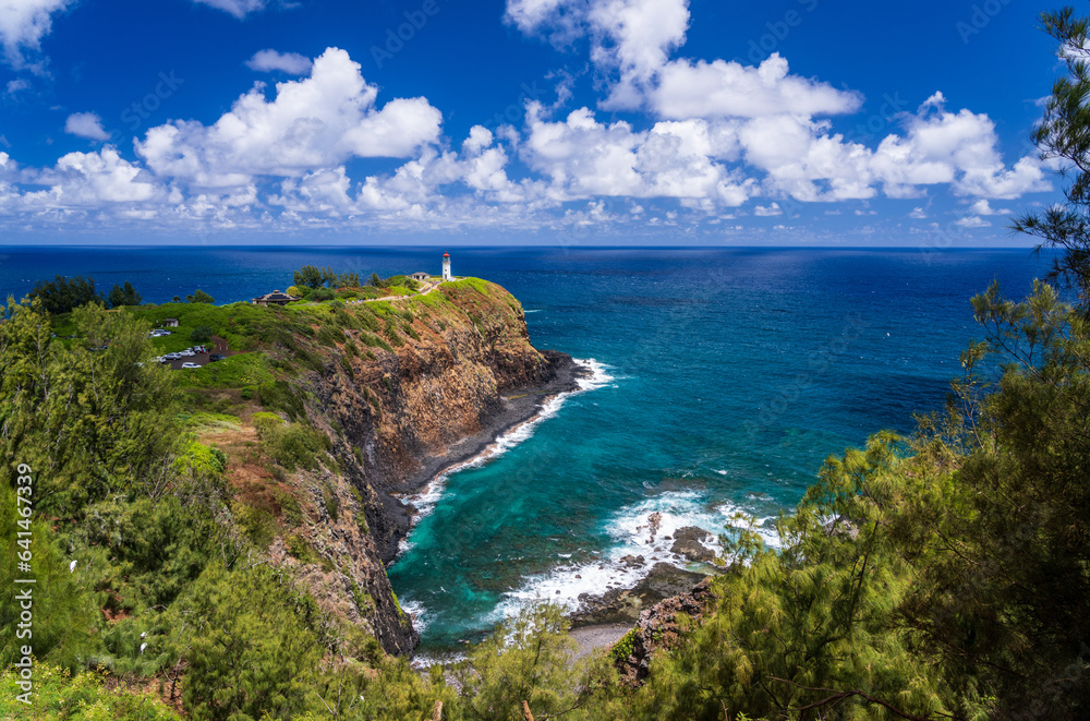 Kilauae Lighthouse on headland above turquoise bay on north coast of Kauai in Hawaii