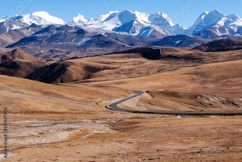 Vászonkép A captivating shot of winding roads traversing the treacherous paths of the Himalayas, as captured from Nyalam, Tibet