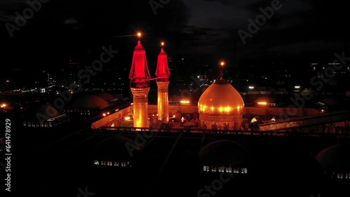 Imam Husayn and Al-Abbas ShrinA night shot by a drone of Shiite visitors and pilgrims at the mosque and shrine of Imam Hussein and Abbas in Karbala, Iraqe photo