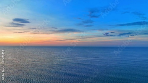 Wallpaper Mural The sea and sky, now wrapped in the embrace of twilight, share an intimate moment of transition, as day gives way to night. The drone's camera captures this ephemeral moment, freezing it in time.
 Torontodigital.ca