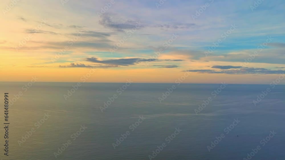 Golden sun rays kiss tranquil waves, painting the sea in hues of orange and pink. The sky awakens with a symphony of colors, as the drone soars, capturing nature's masterpiece at sunrise. 4K.
Golden sun rays kiss tranquil waves, painting the sea in hues of orange and pink. The sky awakens with a symphony of colors, as the drone soars, capturing nature's masterpiece at sunrise. 4K.