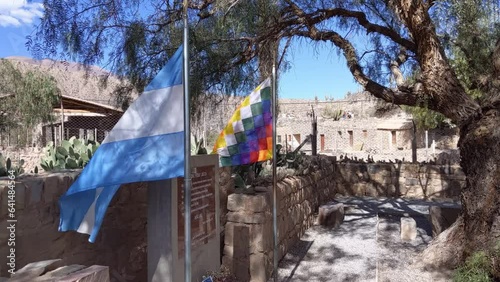 Colourful Wiphala Flag and Flag of Argentina at the Pucara de Tilcara Ruins, A Pre-Inca Fortification in Jujuy, Argentina. photo