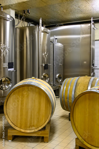 Visit of undergrounds caves with barrels, tanks, bottles on wooden racks, traditional making of champagne sparkling wine in Cote des Bar, Champagne, France photo