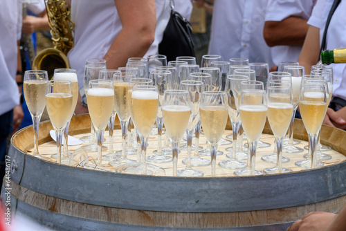 Tasting of sparkling white wine with bubbles champagne on summer festival route of champagne in Cote des Bar, Champagne region, France photo