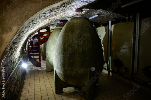Concrete tanks eggs. Visit of undergrounds caves, traditional producing of champagne wine in Cote des Bar, Aube, south of Champagne, France photo