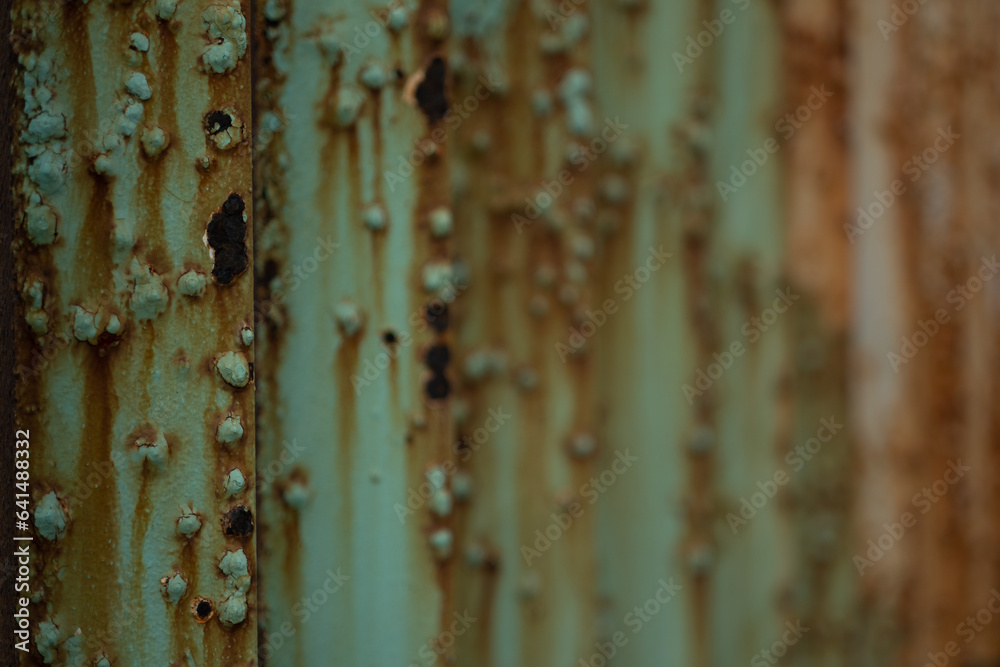 At a section of the US and Mexico border near the ocean in Tijuana, corrosive saltwater leaves long, rusty streaks on the steel border fence.
