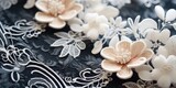 a close up of flowers on a black and white fabric